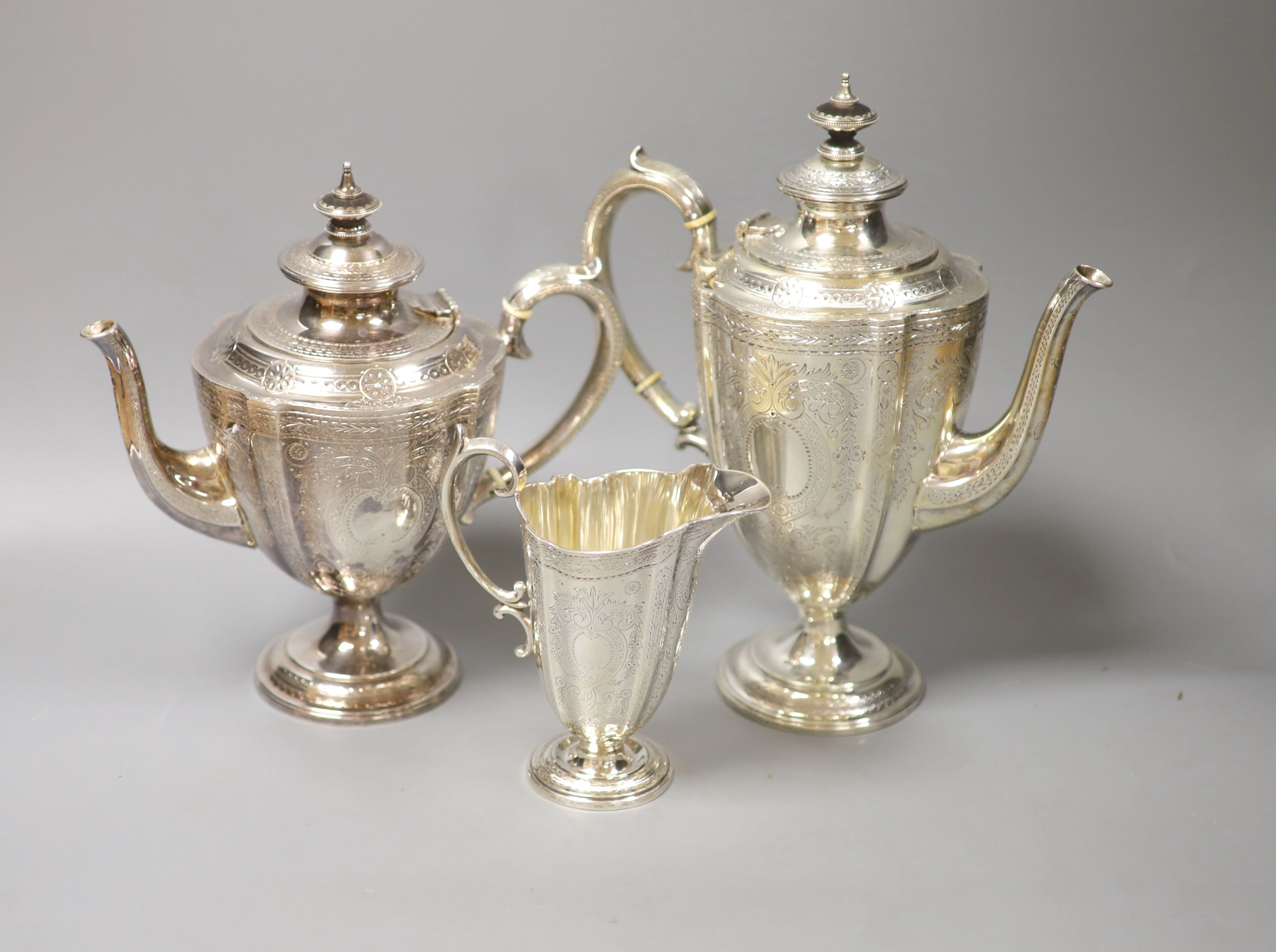 A Victorian engraved silver three-piece tea and coffee service, Frederick Elkington, Birmingham, 1872, tallest piece 27.5cm